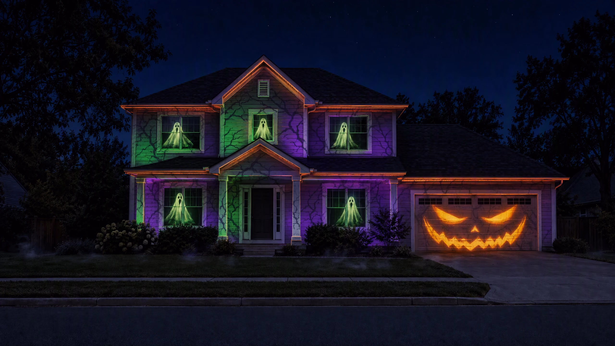 The same house lit with Glowcast's Haunted Facade projection show